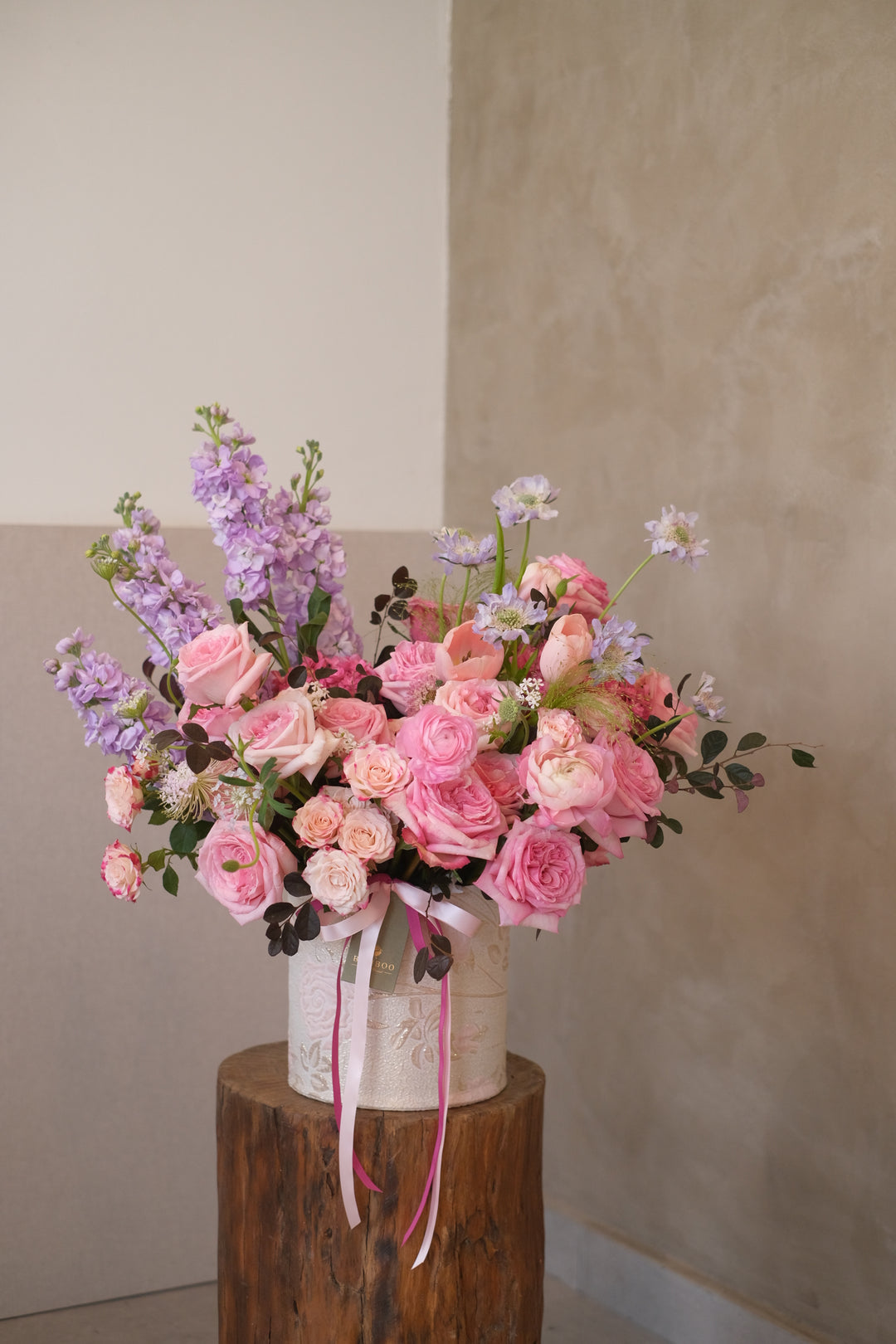 Indulge in a luxurious blend of pink seasonal blooms, evoking cotton candy and cherry blossoms. Expertly arranged by Bamboo Green Florist, Penang. Same-day delivery available!