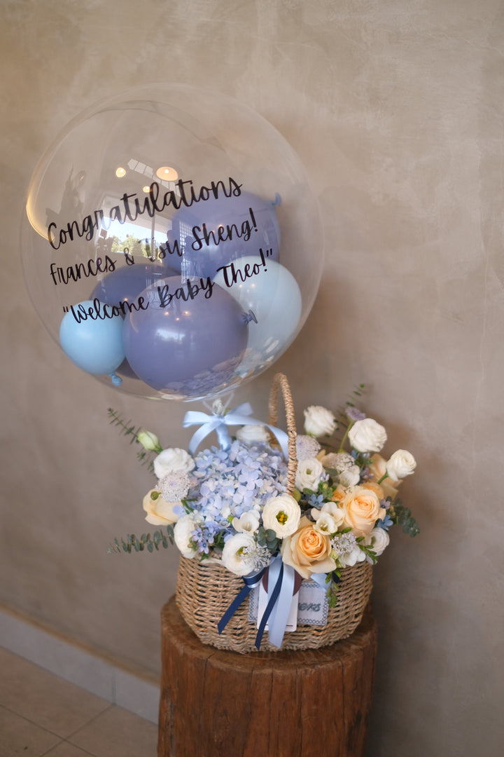 Elegant blue, cream & white flower arrangement featuring hydrangeas, roses, carnations & eustomas. Perfect for any celebration. Same-day delivery in Penang!
