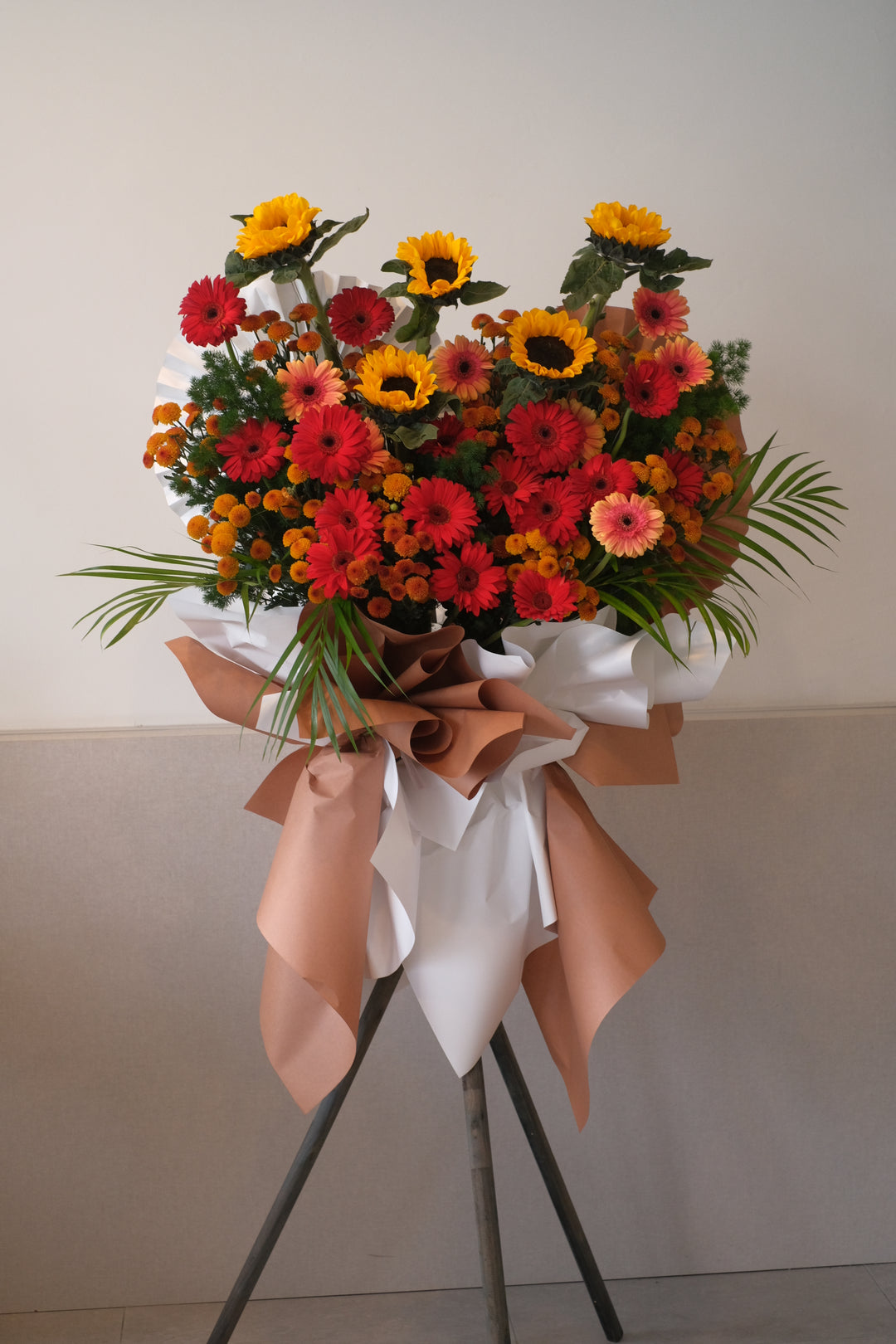 Vibrant and elegant grand opening floral stand featuring a mix of premium blooms, arranged to convey joy and success for penang flower delivery