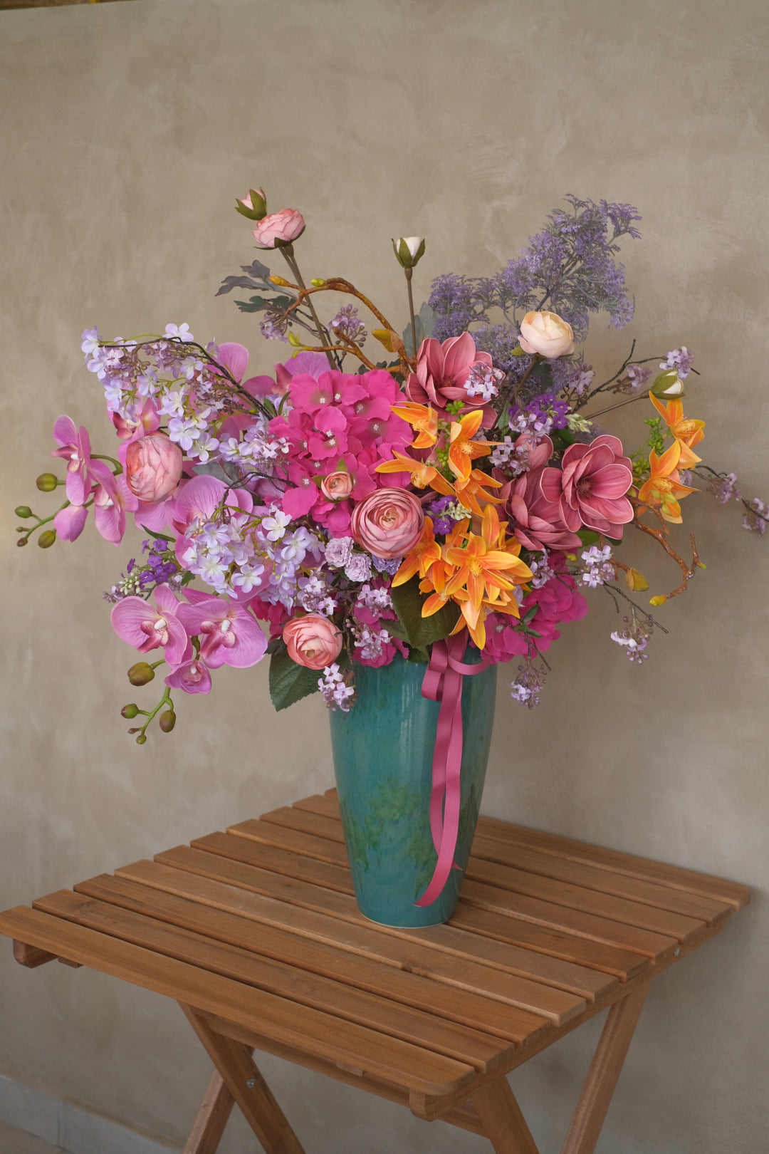bright and vivid artificial flowers in ceramic green emerald pot. same day delivery in penang