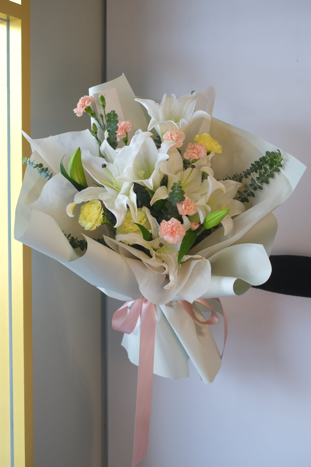 Elegant and fragrant lilies, symbolizing purity and devotion, beautifully arranged for any special occasion.