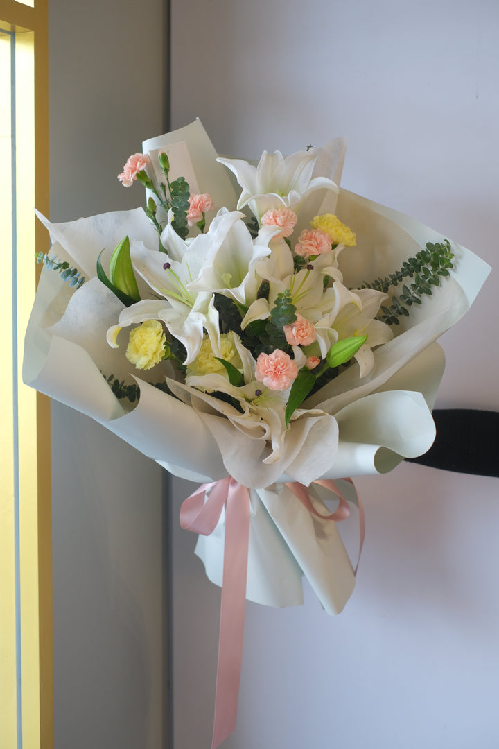 Elegant and fragrant lilies, symbolizing purity and devotion, beautifully arranged for any special occasion.