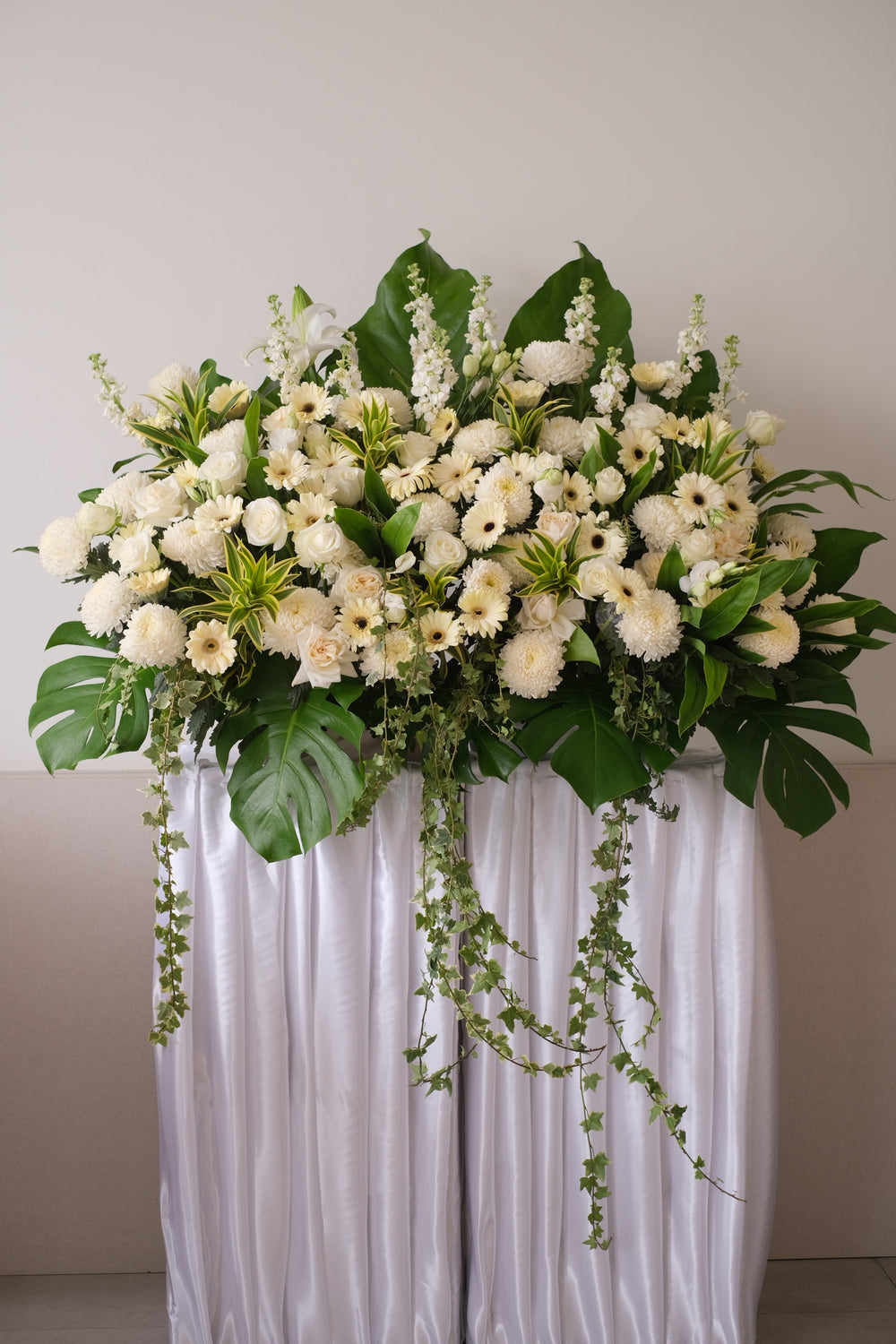 This is the tribute to the special person who lit up everyone’s lives. Comprises of gerberas, poms poms, white soothing chrysanthemums, roses, eustomas and lilies.