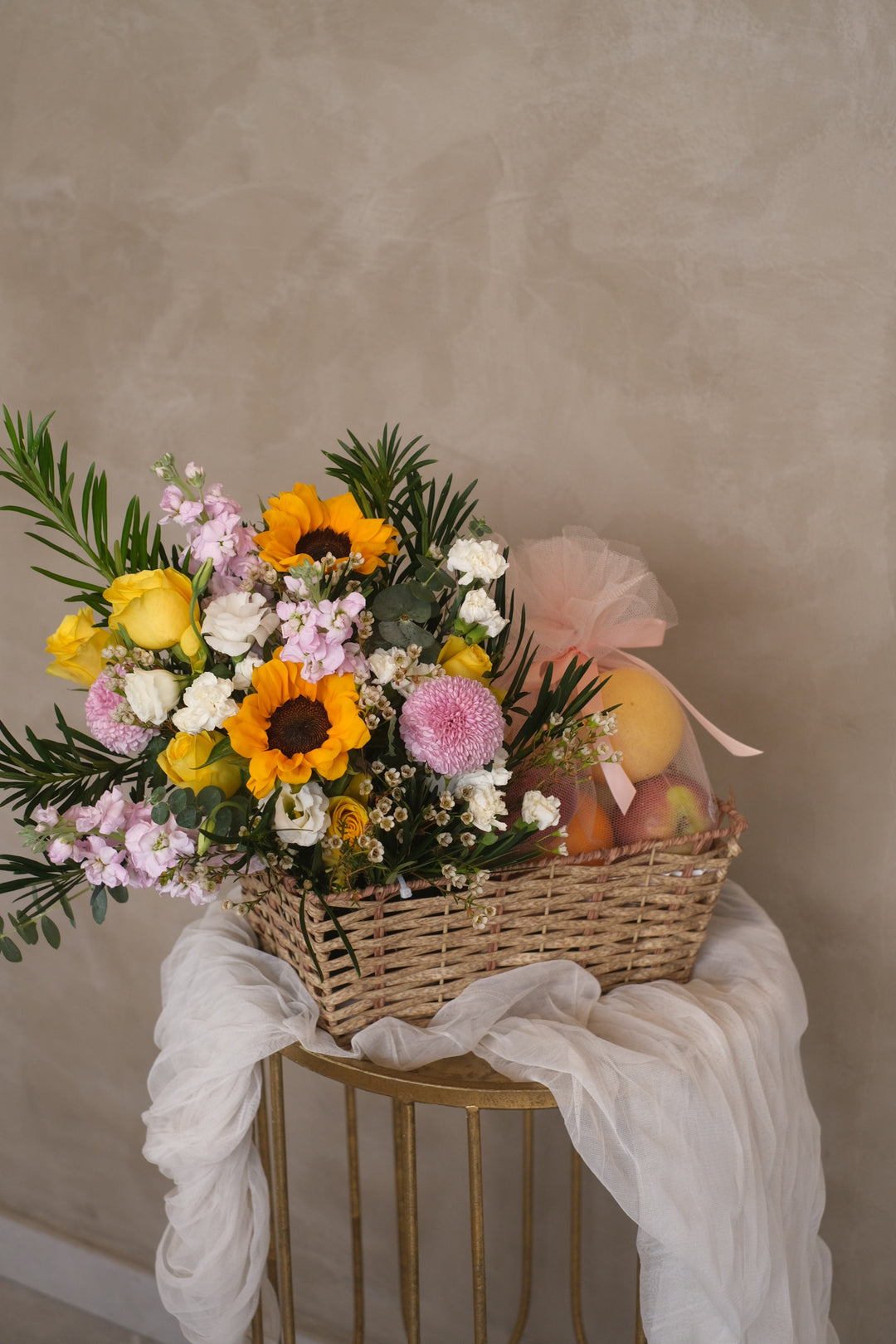 Featuring juicy pears, apples, and oranges, accented with sunflowers, roses, and ping pongs. Penang florist, Order online, deliver same day.