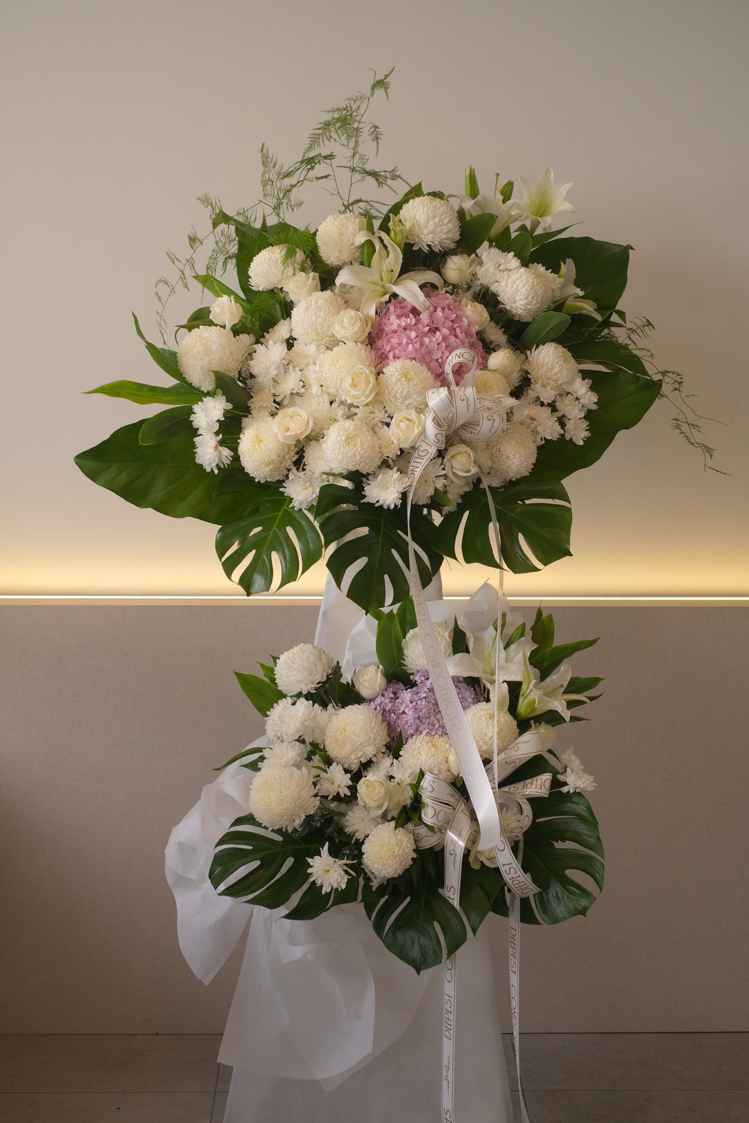 Same-day condolences flowers delivery in Penang - A serene arrangement of white hydrangeas, gerberas, roses, fillers, and greens, expressing love and remembrance during a difficult time."