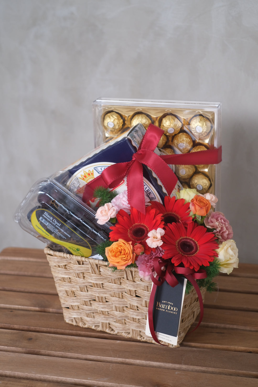 Enjoy an instant health kick with Healthy Bonanza Basket, featuring grapes, butter cookies, and Ferrero Rocher, paired with fresh flowers & foliage. Penang florist, Order online, deliver same day
