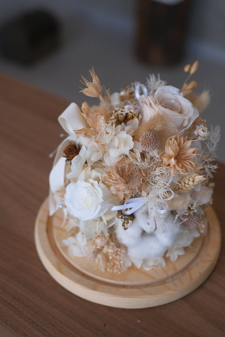 Featuring preserved roses, hydrangeas, craspedia, and bunny tails in a bell jar. Penang florist, Order online, deliver same day, preserved flowers.