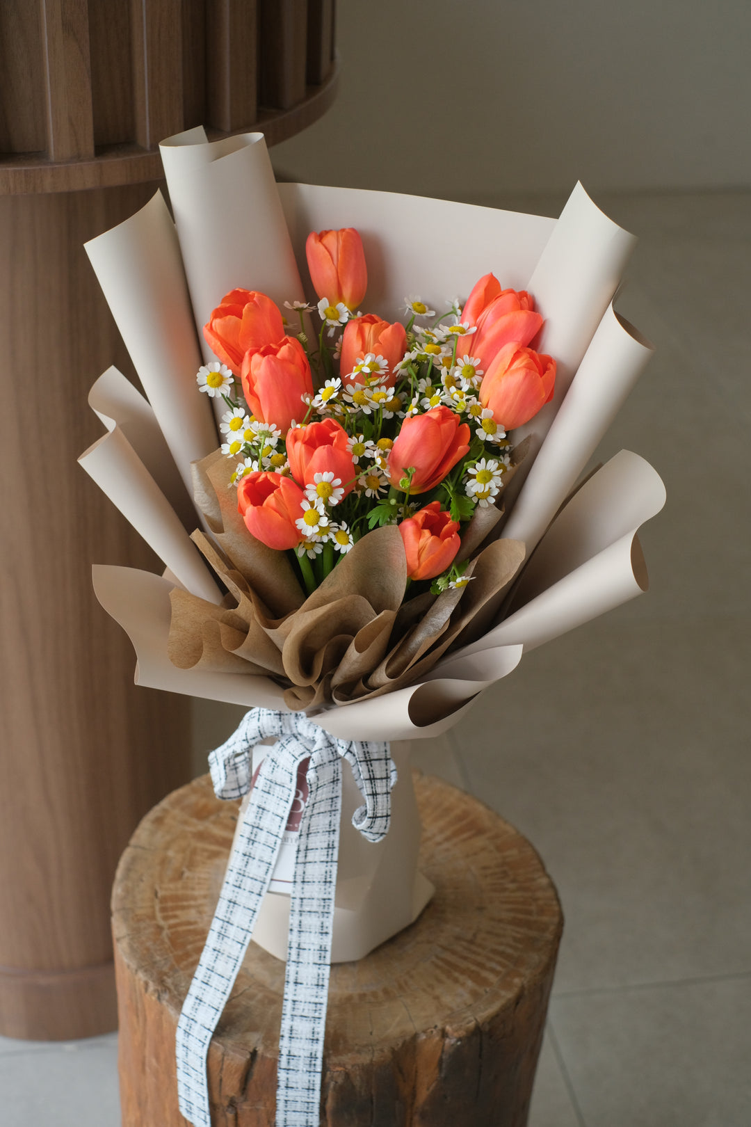 A charming bouquet of tulips paired with delicate chamomile, blending elegance with a touch of whimsy. Perfect for any heartfelt occasion. Order online from Bamboo Green Florist, your trusted Penang florist.