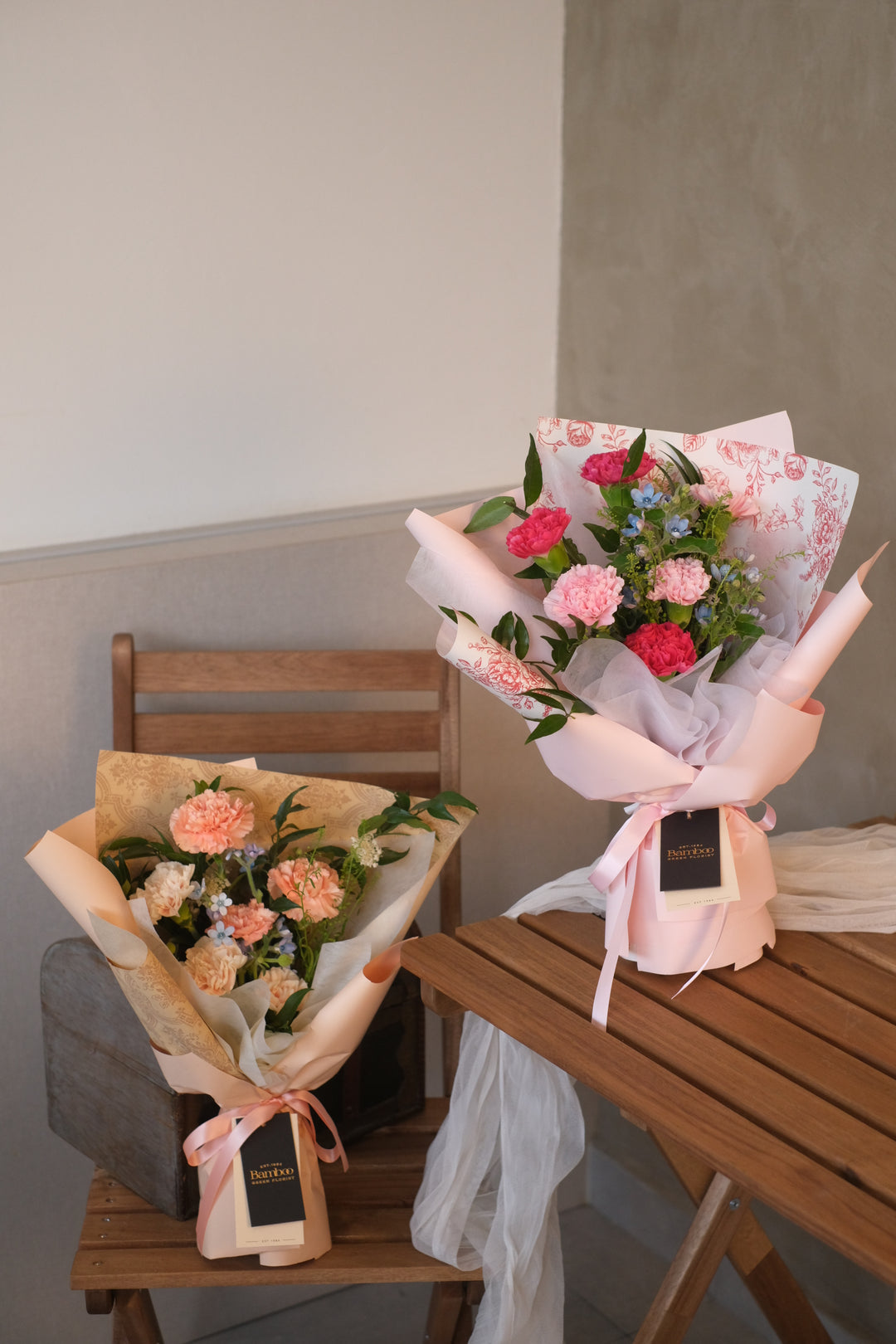 An elegant bouquet of assorted flowers, including carnations, roses, and lilies, arranged in a vase. The vibrant colors and delicate blooms convey love, gratitude, and appreciation for mothers and mother figures.