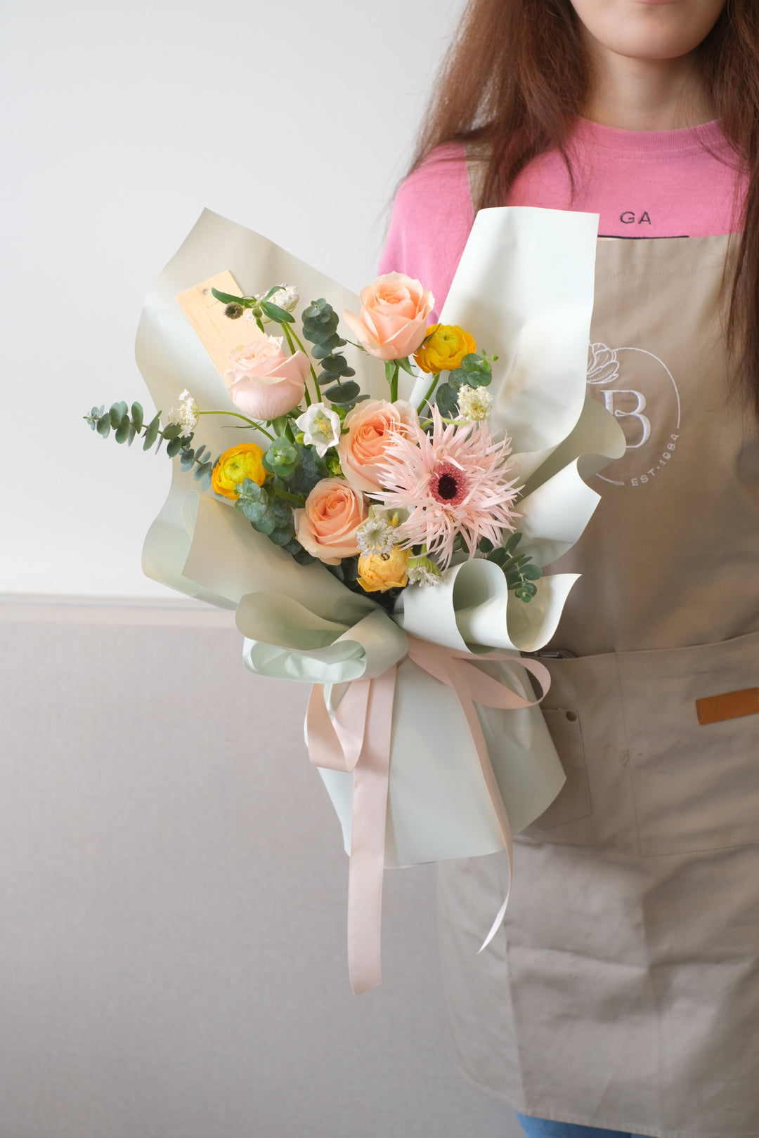  stunning bouquet of fresh ranunculus, gerberas, daisies, and more, evoking the vibrancy of morning dew. Promoting same-day delivery in Penang and Butterworth