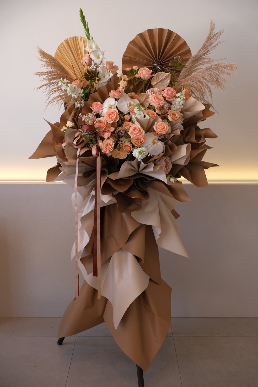 “Omakase earthy muse grand opening flowers in terracotta and nude tones with orchids, roses, and pampas | Bamboo Green Florist Penang | Neutral elegant flower stand Malaysia.”