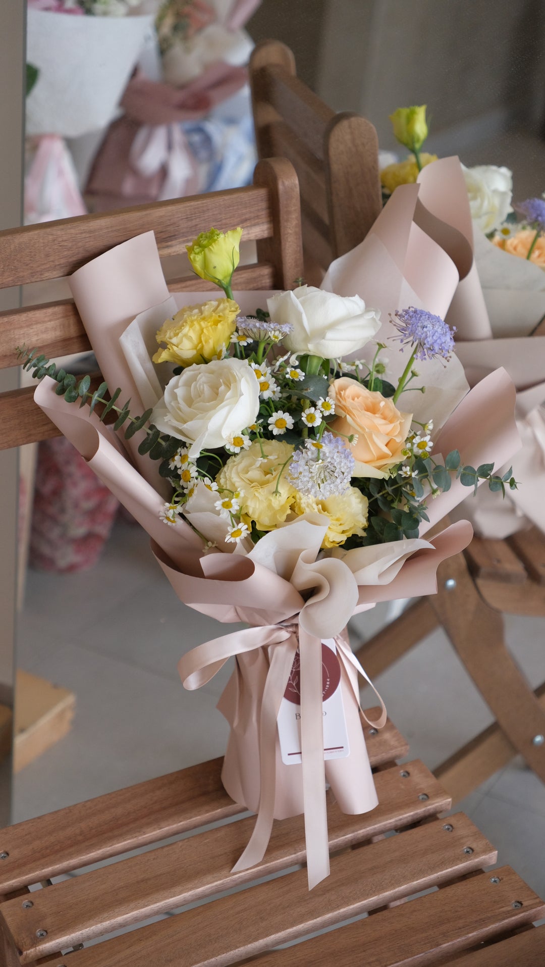 A romantic Valentine's Day bouquet featuring a delicate mix of three roses, eustoma, and chamomile—perfect for expressing love. Order online from Bamboo Green Florist, your trusted Penang florist.