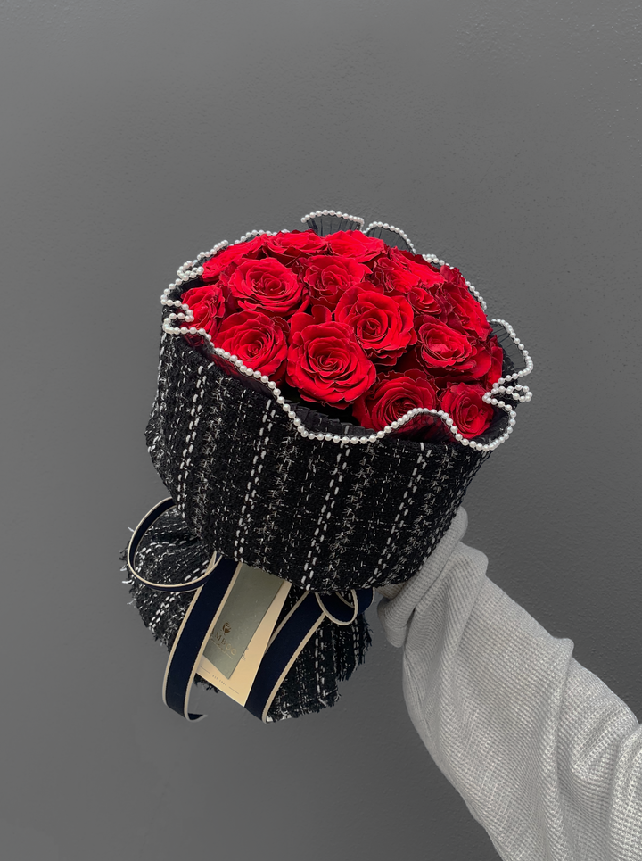 A passionate bouquet of premium imported red roses, laced with pearls and wrapped in coco weave. Shop online at Bamboo Green Florist, your trusted Penang florist.