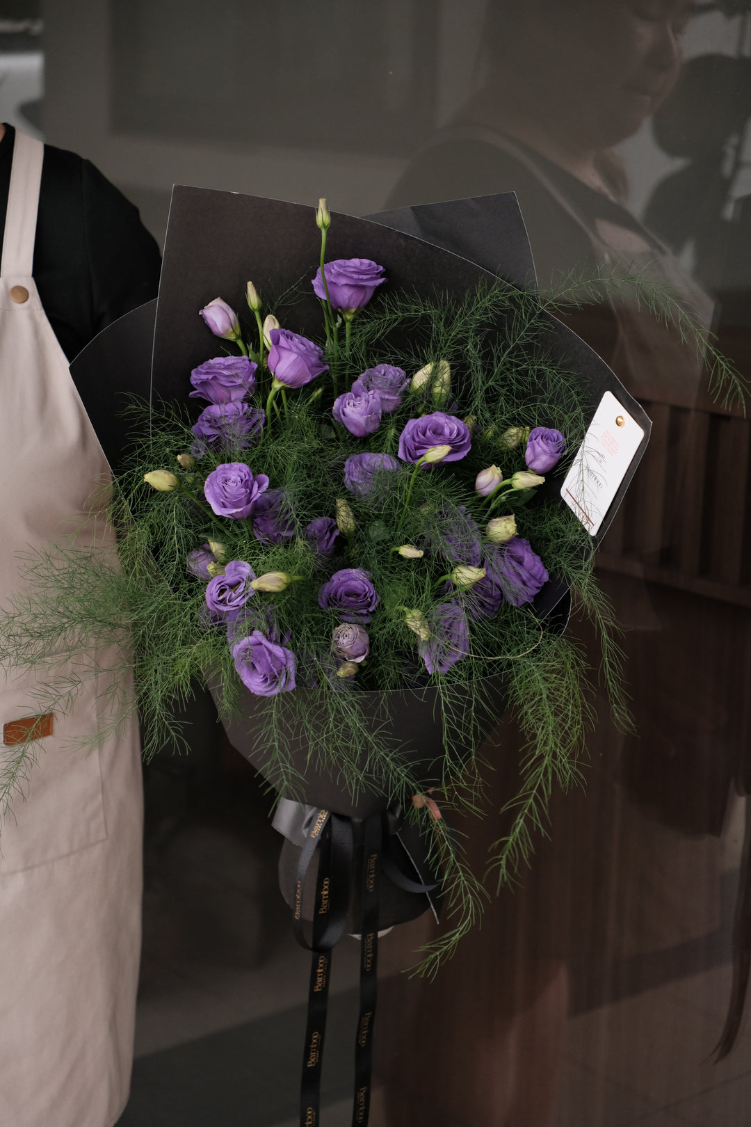 Éclat Violet bouquet with fresh purple eustoma and black wrapping by Bamboo Green Florist Penang