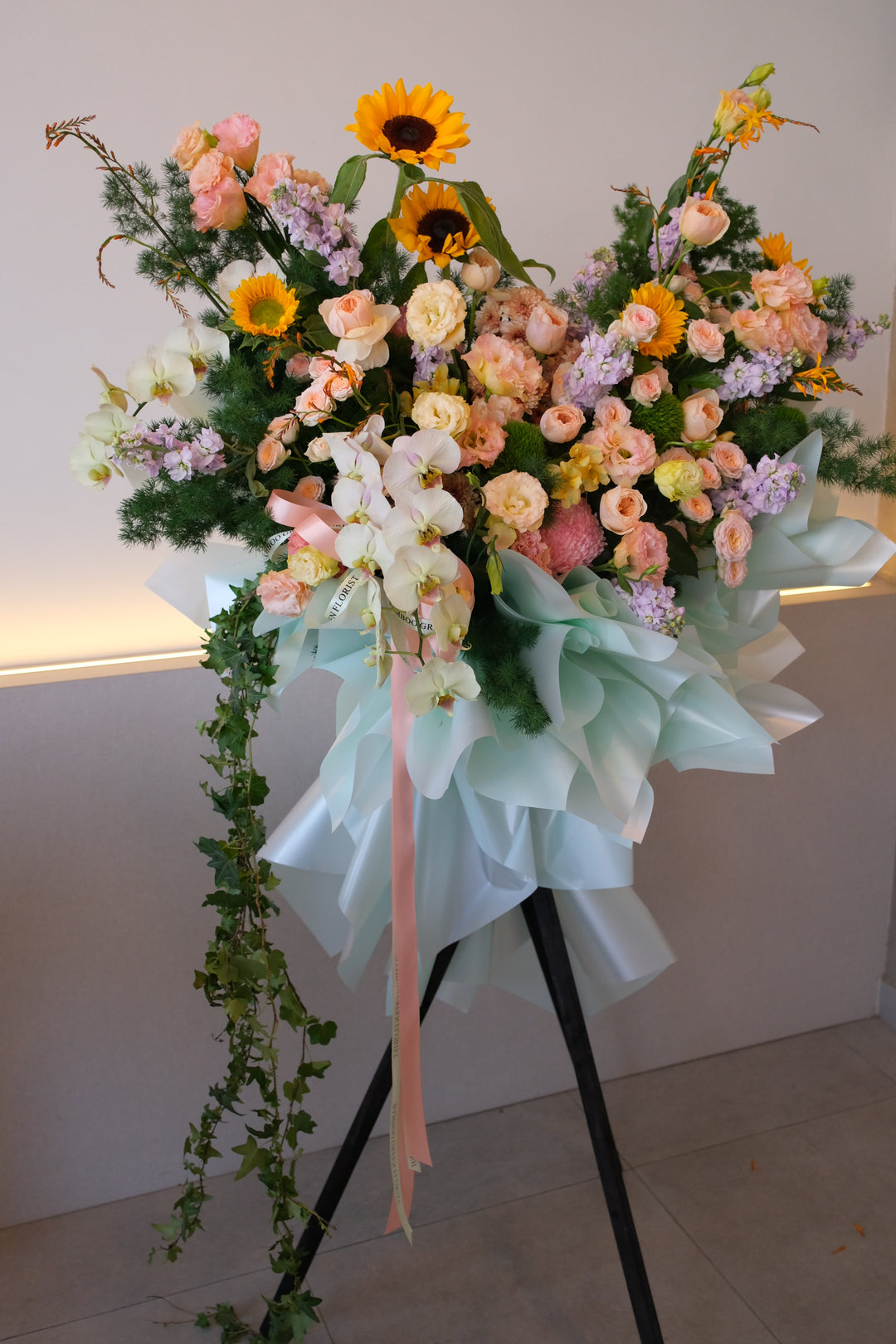 “Omakase botanical grand opening flowers with orchids, sunflowers, and pastel blooms | Bamboo Green Florist Penang | Botanical flower stand Malaysia.”