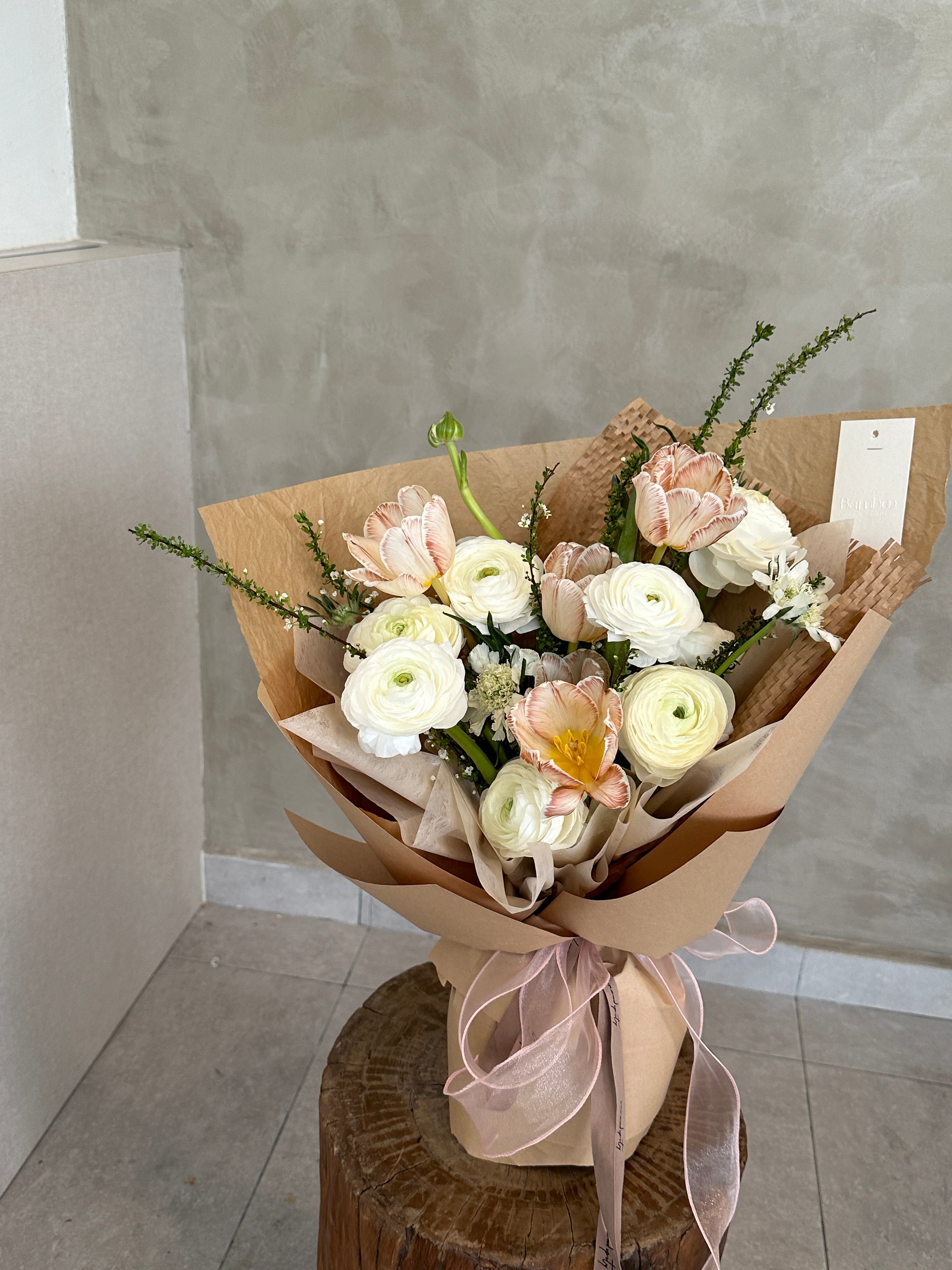 Leave it to us to create an original design with current in season flowers - ranunculus. The ranunculus blooms in the early spring and will continue to do so until the beginning of summer 
