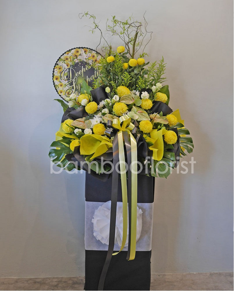 The loss of a loved one can be hard to accept. To help offer your condolences, and remember the joy they brought in life, we've put together eustoma, ping pong, chrysanthemums, ping pong, daisies, pompoms and lush ferns to honor your loved one. Send your condolences, or remember their life with one last Celebration. For same day condolences flowers delivery in Penang.