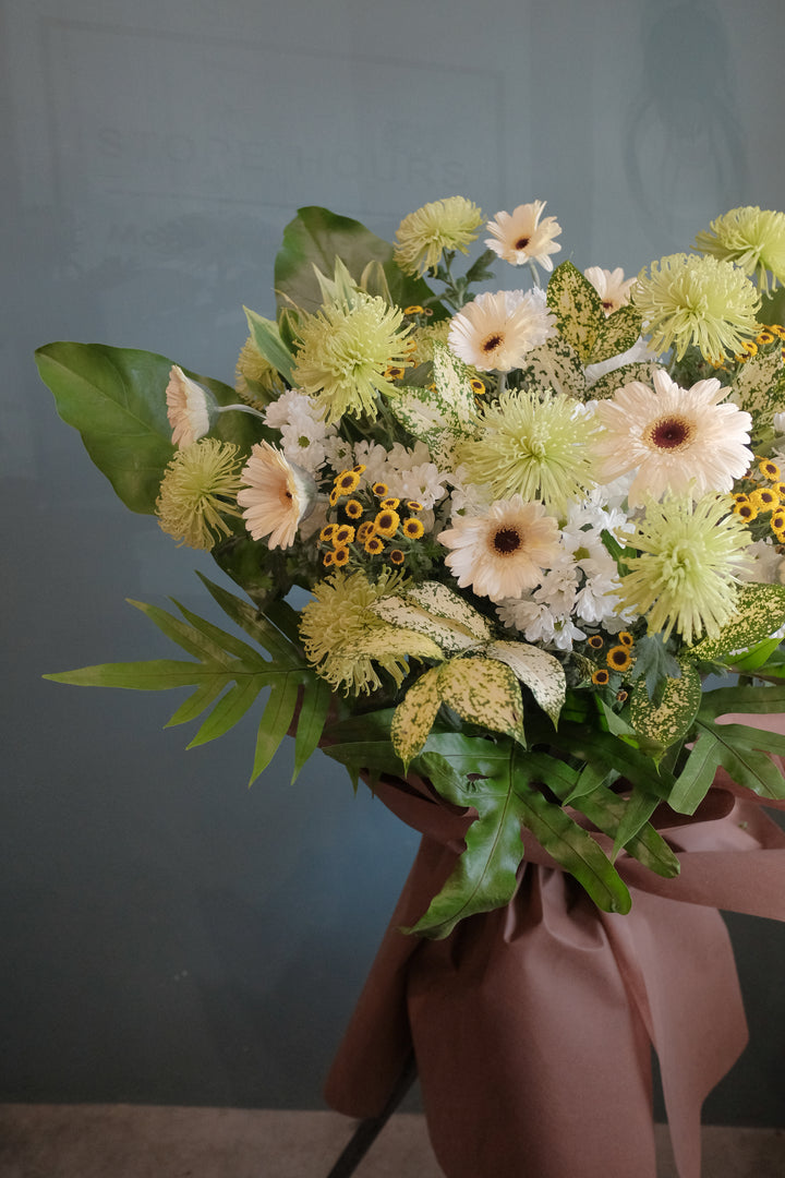 The loss of a loved one can be hard to accept. To help offer your condolences, and remember the joy they brought in life, we've put together lilies, gerberas, chrysanthemums, dancing lady, anthuriums, pompoms and lush ferns to honor your loved one. Send your condolences, or remember their life with one last Celebration. For same day condolences flowers delivery in Penang.