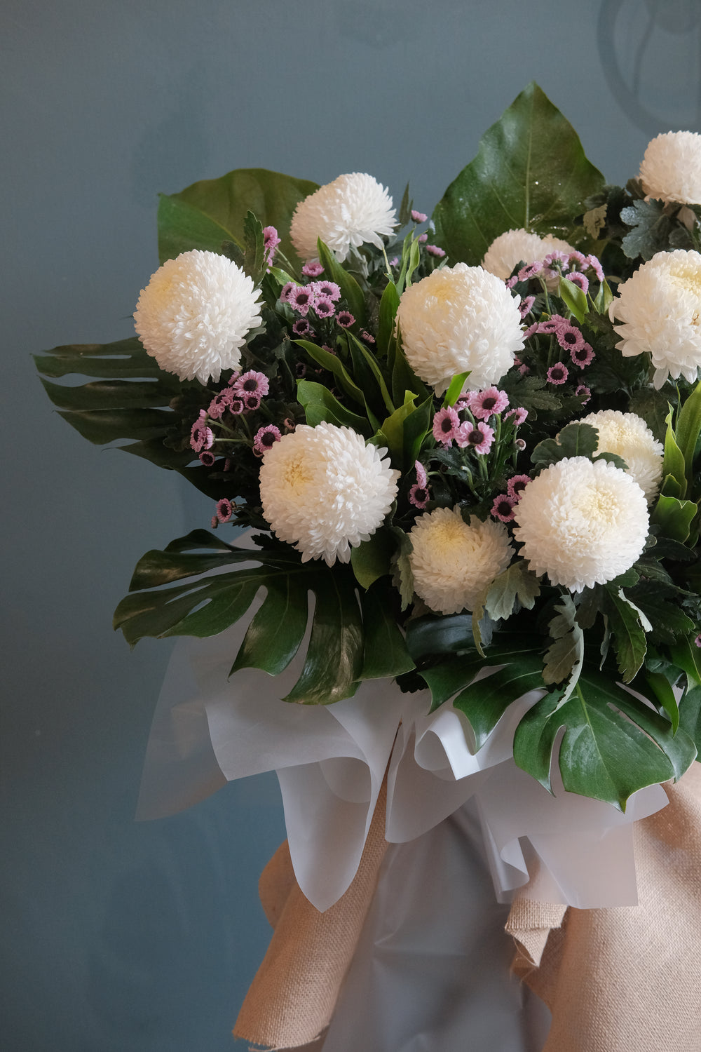Featuring the freshest flowers to honour the deceased and shine to lift spirits up. For same day condolences flowers delivery in Penang.