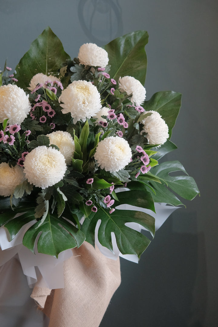Featuring the freshest flowers to honour the deceased and shine to lift spirits up. For same day condolences flowers delivery in Penang.