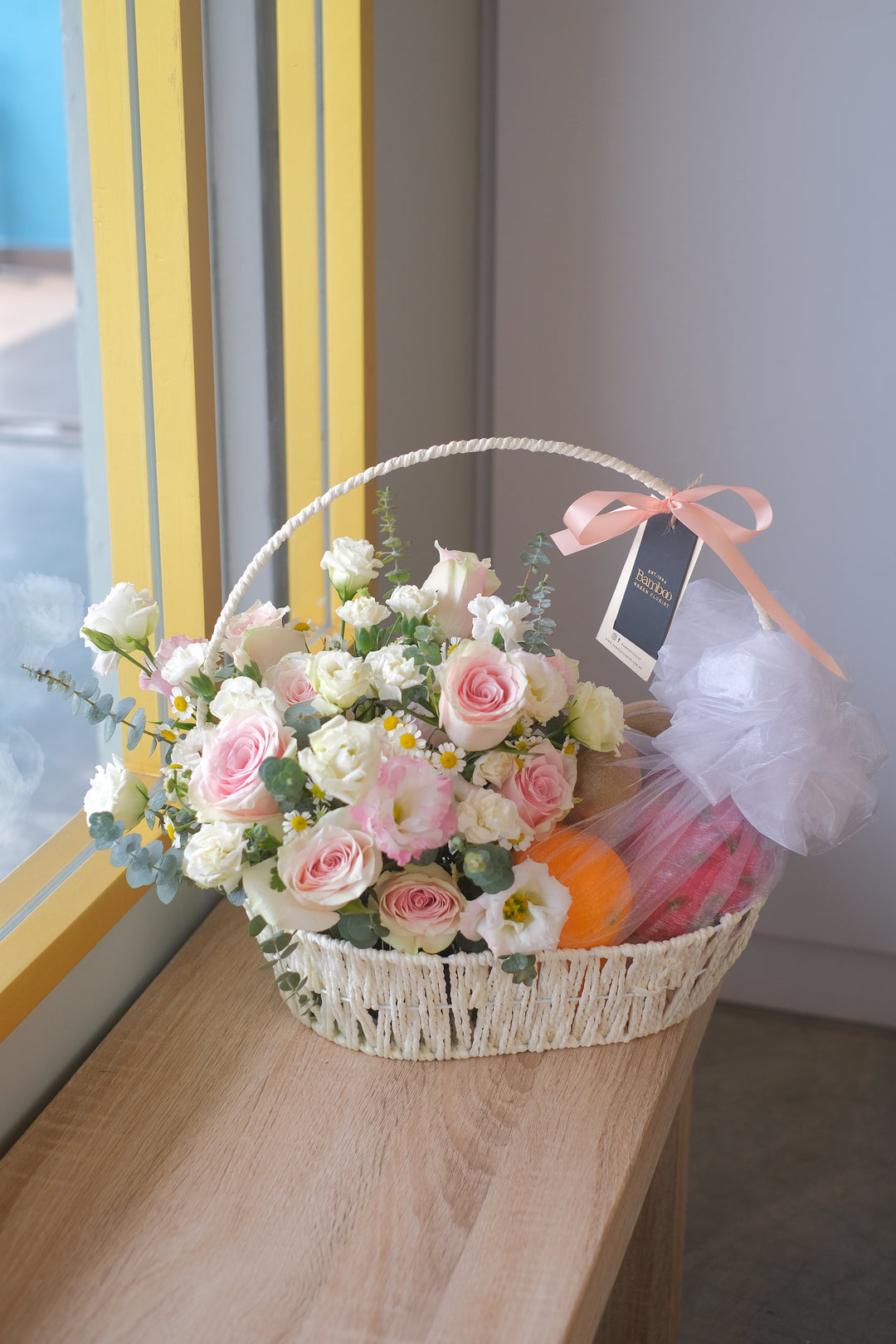 Brightened by fresh blooms, this fruit basket is packed with tropical & imported fruits. Order from No 1 Online Penang Florist, delivery same day available