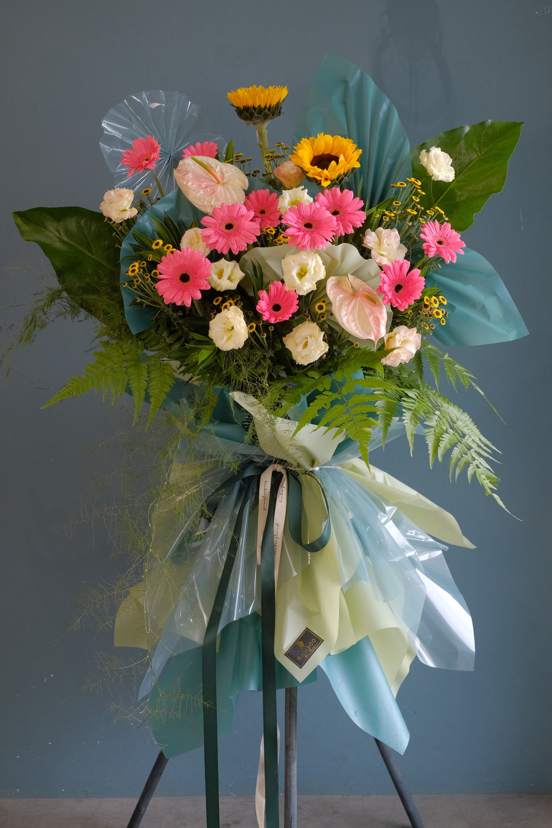 Surprise recipients with a lavish floral stand of abundant pink tone lush flowers. For same day grand opening congratulations flowers delivery in Penang and Butterworth.