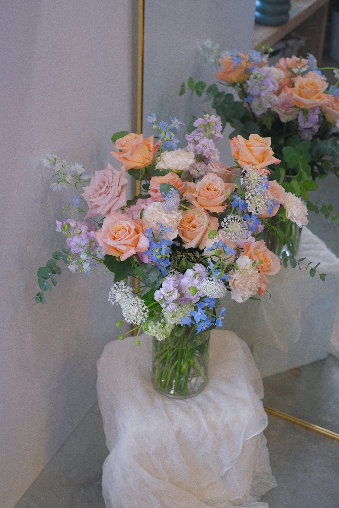 Elegantly arranged in a glass vase, this bouquet features soft, elegant blooms perfect for housewarmings, birthdays, baby showers, or engagements. Same-day delivery by Penang Florist.