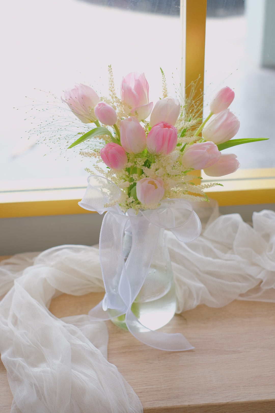 Pretty pink tulips arranged in a vase with delicate fillers. A perfect gift for any occasion. Same-day delivery by Penang Florist, Bamboo Green Florist.