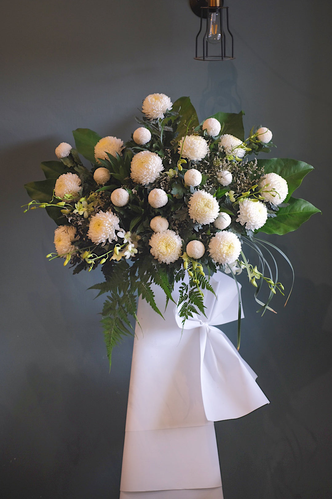 This serene arrangement is an enduring sign of love and sympathy. For same day condolences flowers delivery in Butterworth