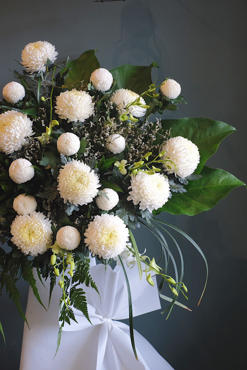 This serene arrangement is an enduring sign of love and sympathy. For same day condolences flowers delivery in Butterworth
