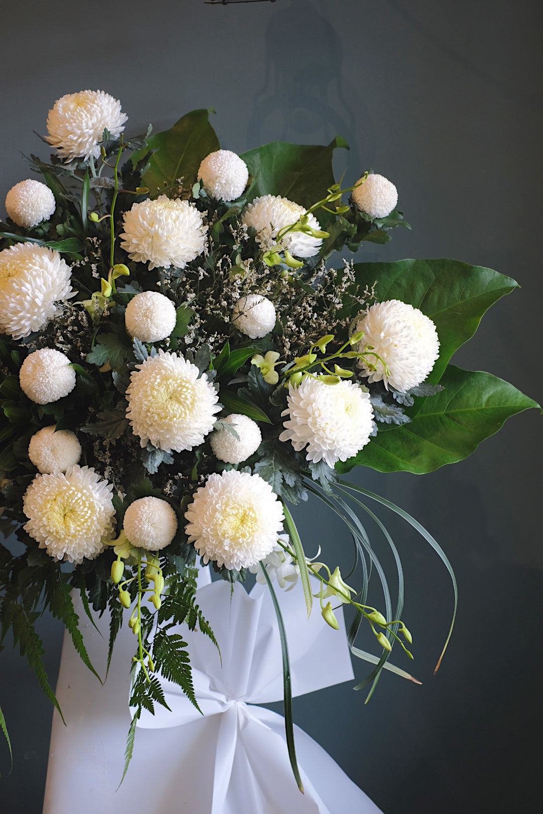This serene arrangement is an enduring sign of love and sympathy. For same day condolences flowers delivery in Butterworth