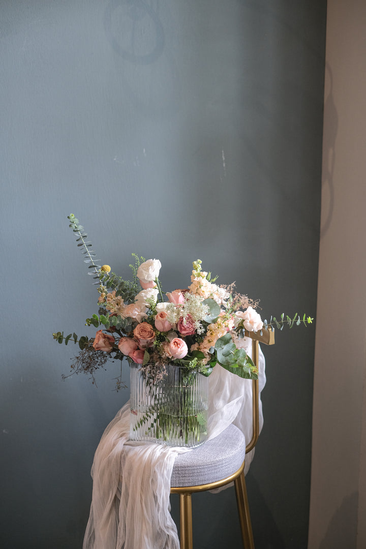 Florence exudes timeless elegance with soft white, champagne, and cappuccino hues, creating a sophisticated and refined floral arrangement.
