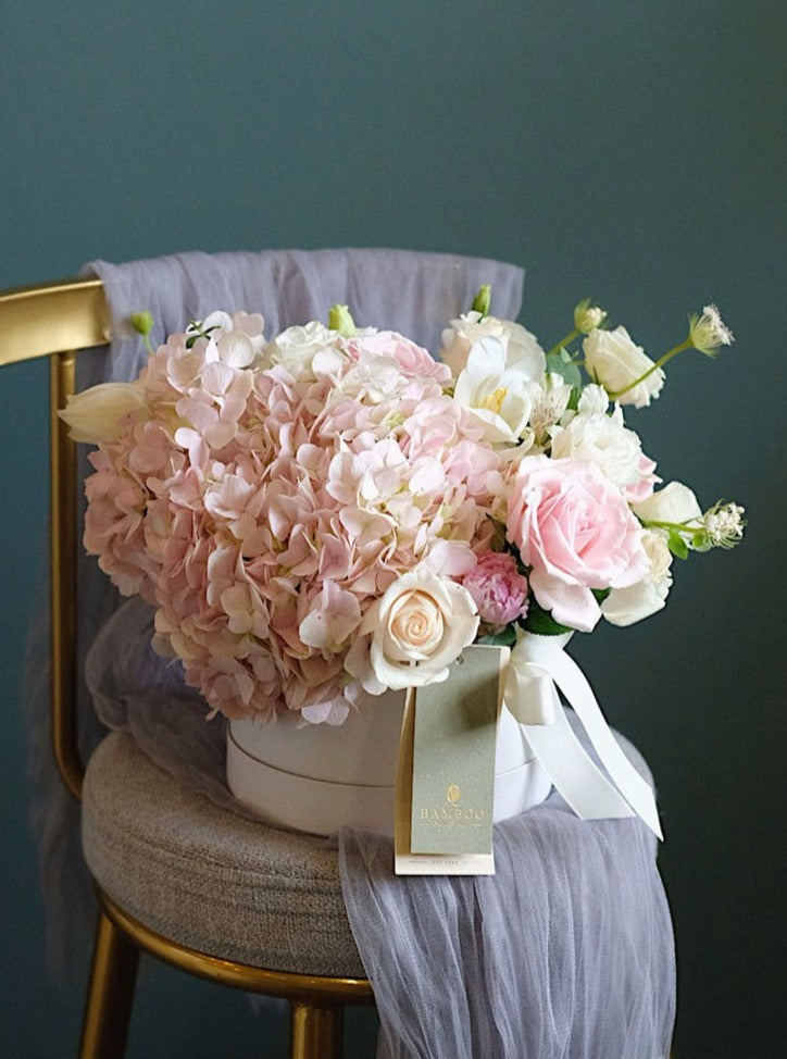 A timeless romantic statement with pink and white blooms. Our florists craft each bouquet with the freshest seasonal flowers for a unique and elegant touch.