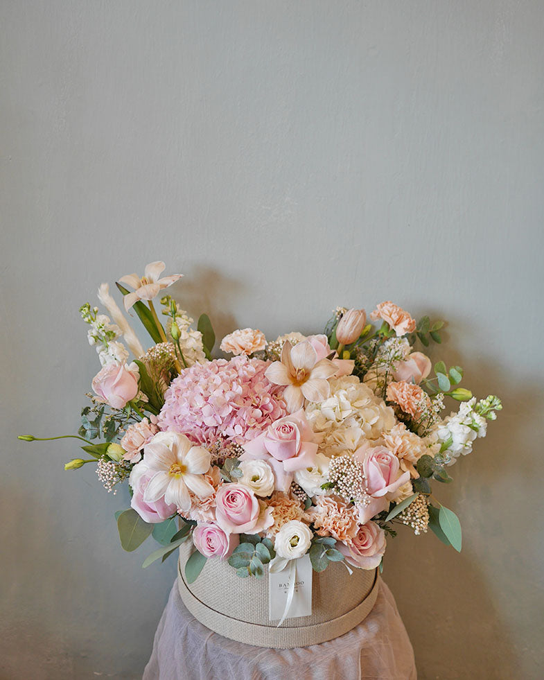 Signature Bloom Box featuring an intriguing mix of hydrangeas, tulips, roses, carnations, matthiolas, and seasonal fillers. Penang florist, order online, same-day delivery available.