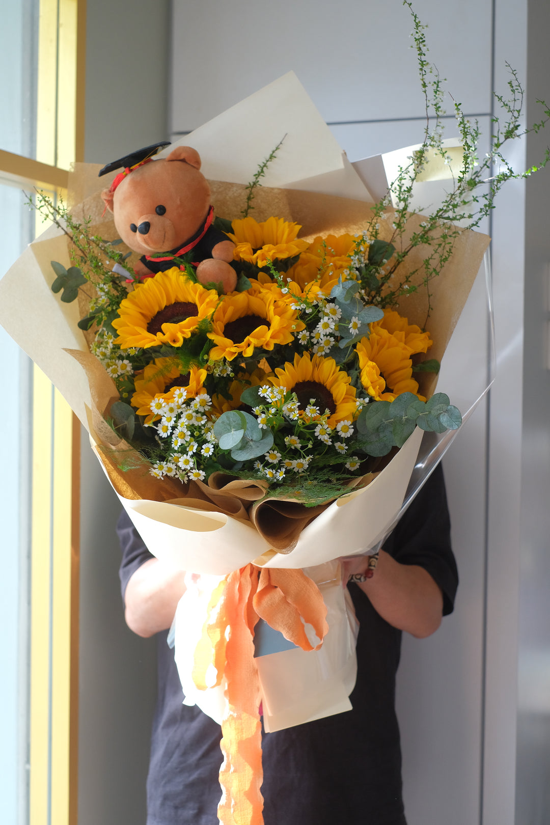 Bright and cheerful sunflower bouquet, featuring 10 vibrant sunflowers. Perfect for graduations and celebrations. Penang florist, order online, deliver same day.
