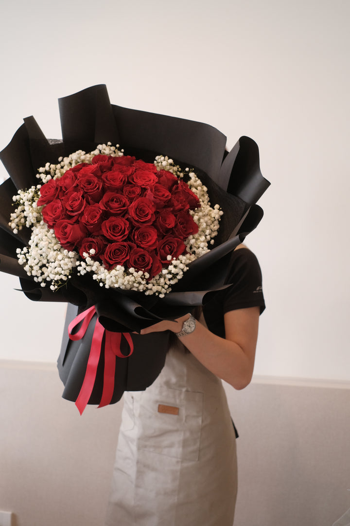 Vibrant bouquet of 30 fresh red roses available for same-day delivery in Penang Island.