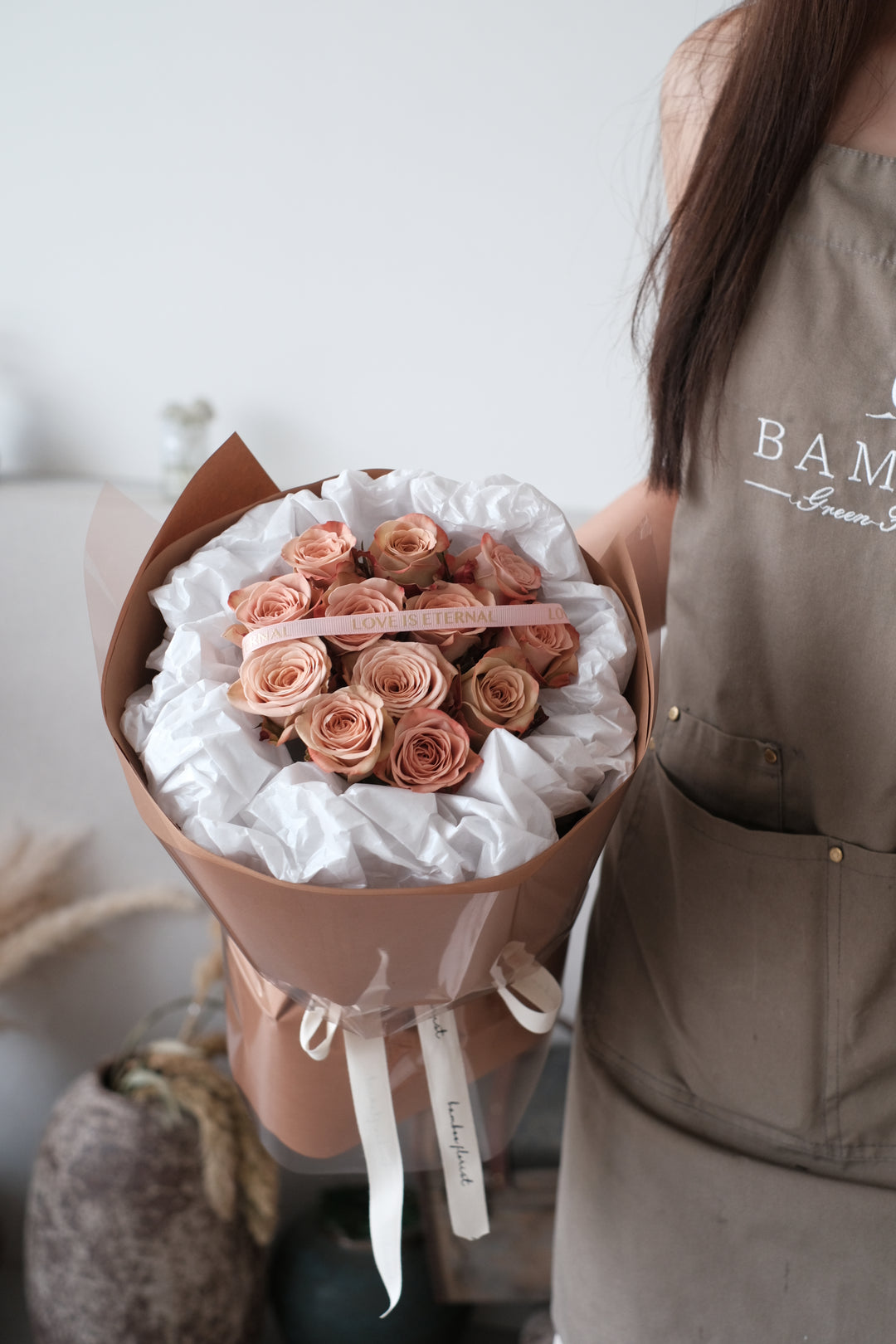 12 stalks of premium Cappuccino roses, exuding elegance and charm. Order online from Bamboo Green Florist, your trusted Penang florist with delivery.