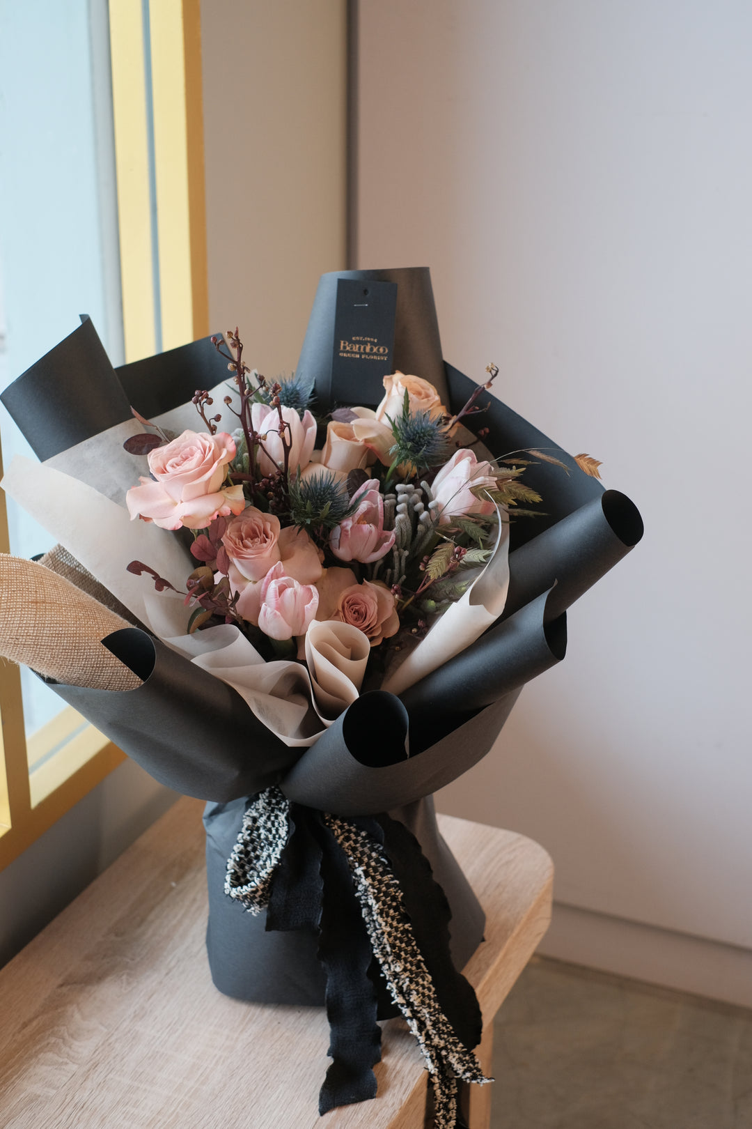 coffee-inspired flower arrangement with cappuccino roses, tulips and eryngium, available as graduation bouquet, bridal bouquet or proposal with flowers