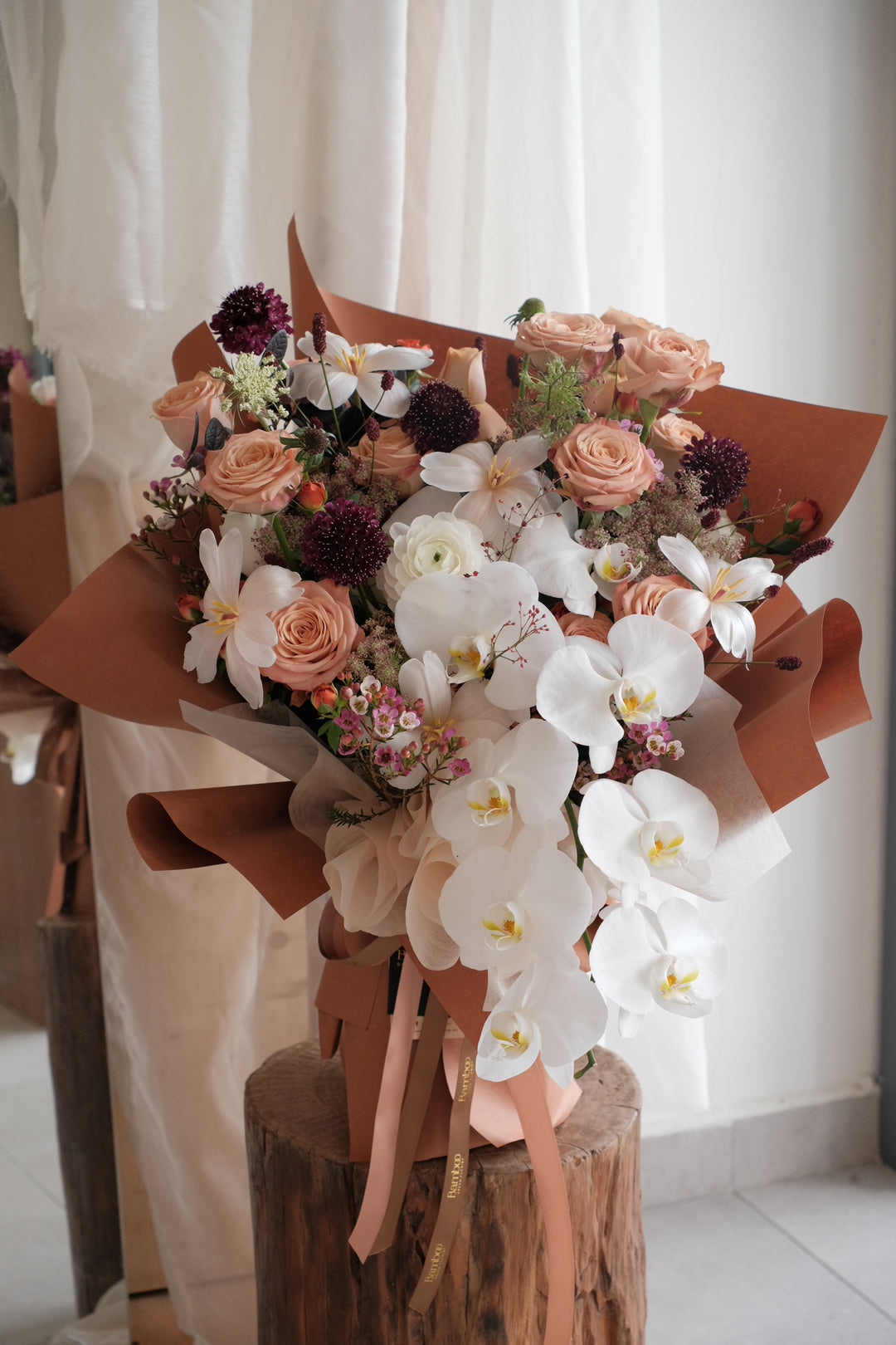 Coffee on the Agenda omakase bouquet, Baby Grand size, warm coffee-toned florals by Bamboo Green Florist, Penang.