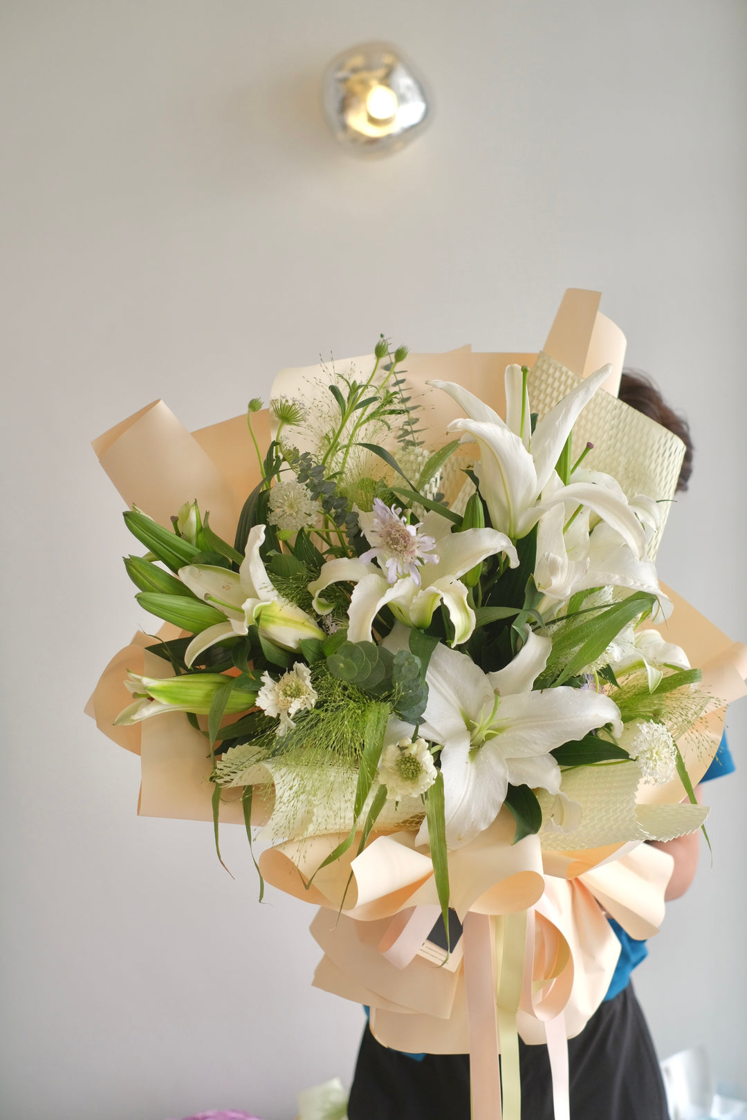 Elegant white bouquet of lilies, available for same-day delivery to Bukit Mertajam and Alma by Bamboo Green Florist, Penang's top online florist