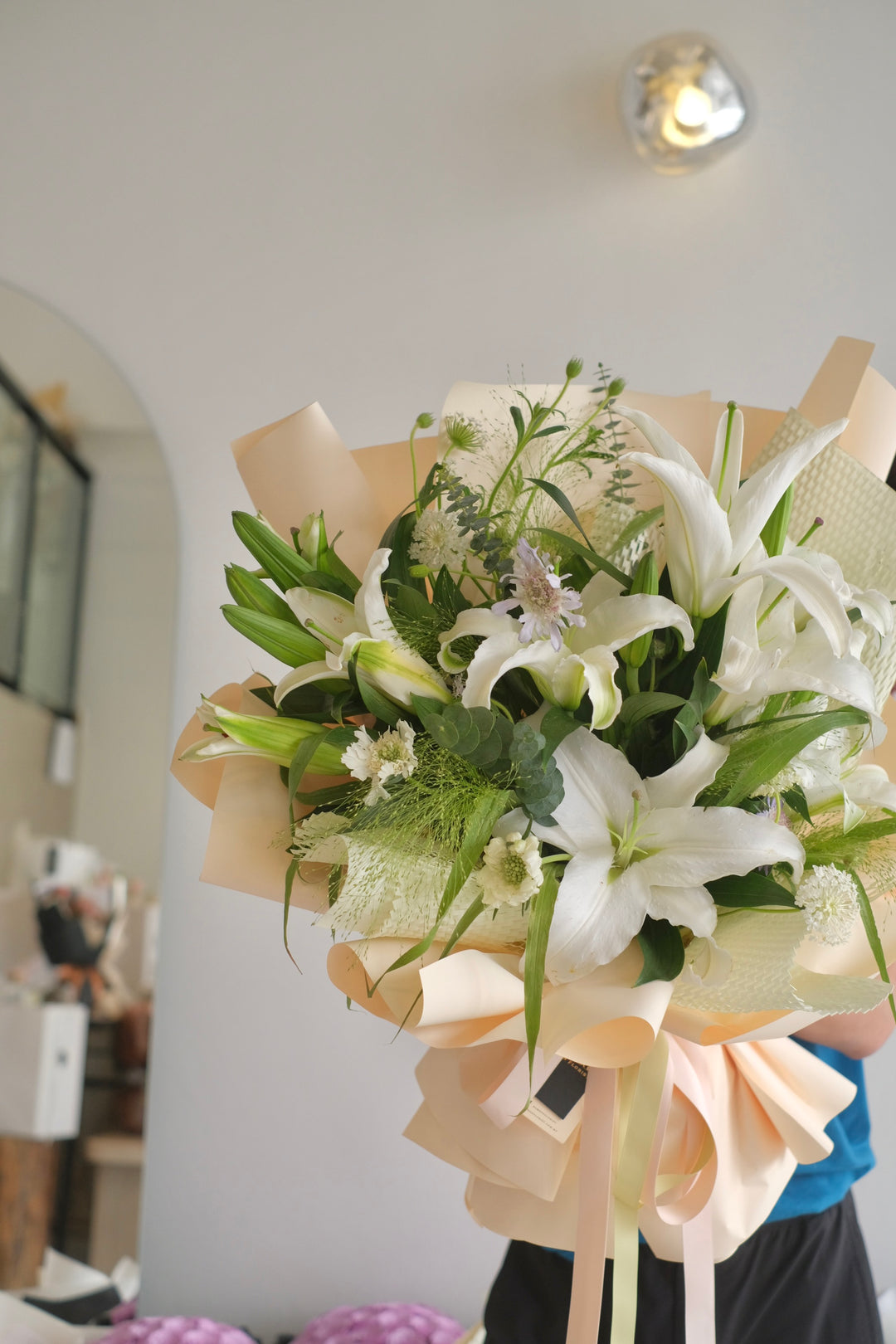 Elegant white bouquet of lilies, available for same-day delivery to Bukit Mertajam and Alma by Bamboo Green Florist, Penang's top online florist