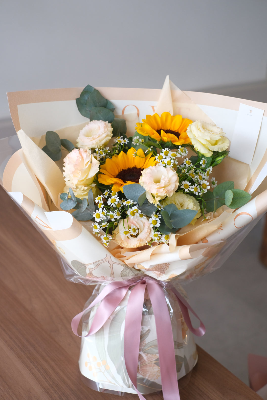 Send a message to someone special that they're the sunshine of your life with this explosion of sunny sunflowers with a hint of caramelized. This is an exuberant bouquet that will bring immense happiness into anybody's day!