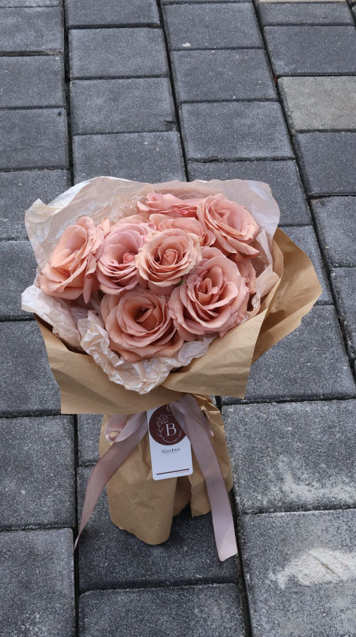 12 stalks of exquisite Moab roses, perfect for an elegant and timeless gift. Order online from Bamboo Green Florist, your trusted Penang florist with delivery.