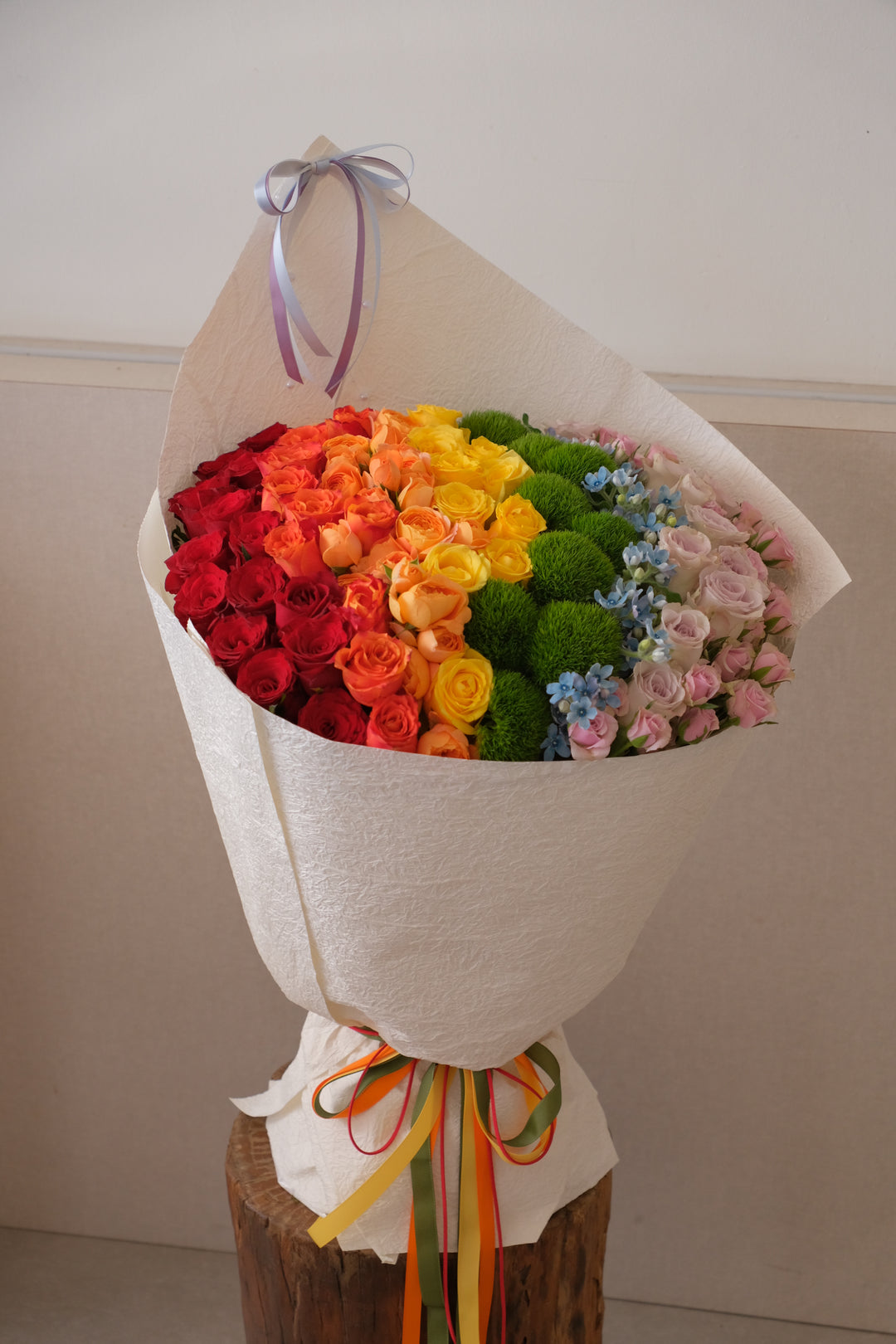 Bouquet of flowers with a rainbow color gradient, florist delivery in Bukit Mertajam