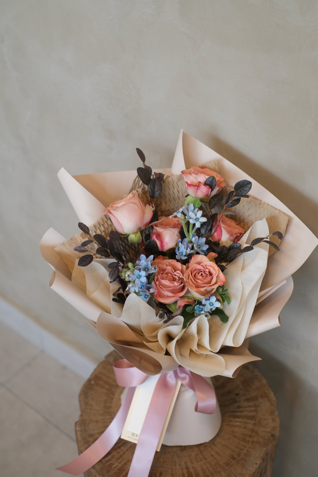 Nude-toned bouquet with Coffee Mood, Quicksand, and Cappuccino roses, wrapped in chic beige for an elegant touch. Order online from Bamboo Green Florist, Penang florist with delivery.