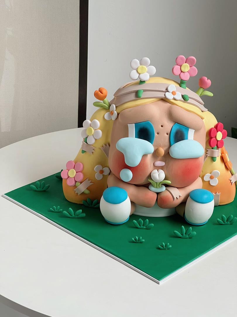 Handcrafted Cry Baby plush cake with pastel design for birthday celebration in Penang