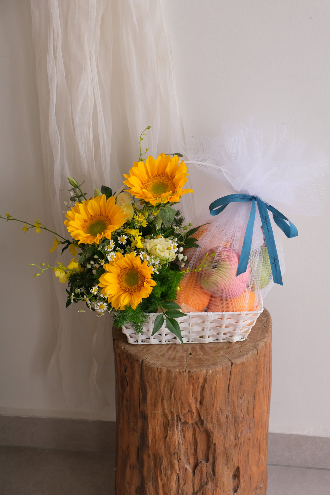 Sunny Harvest Basket — sunflower and fresh fruit gift basket with white tulle wrap, Bamboo Green Florist Penang