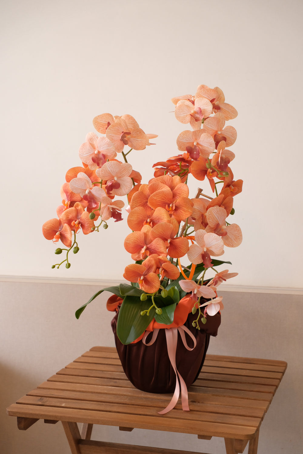 Luxury artificial orchids wrapped in satin fabric