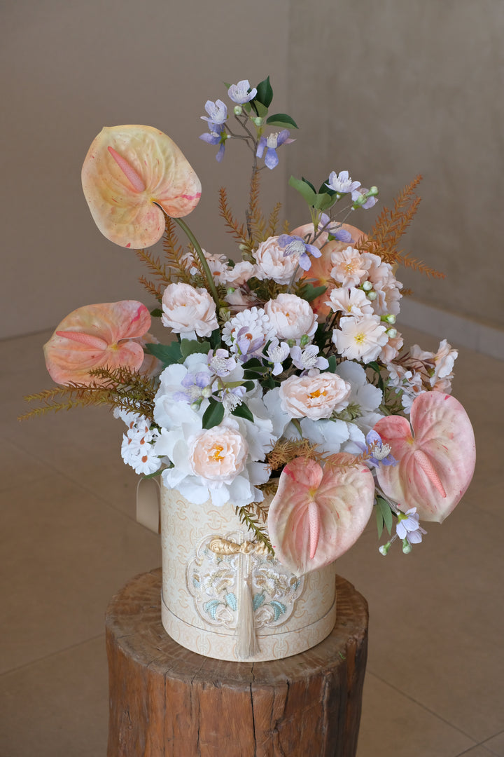 Elegant artificial flowers in oriental-inspired box with tassel