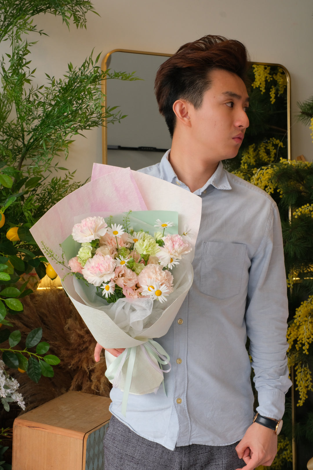 Soft pink carnation and daisy bouquet for Mother’s Day, pastel wrapping, elegant hand-tied flowers for mum